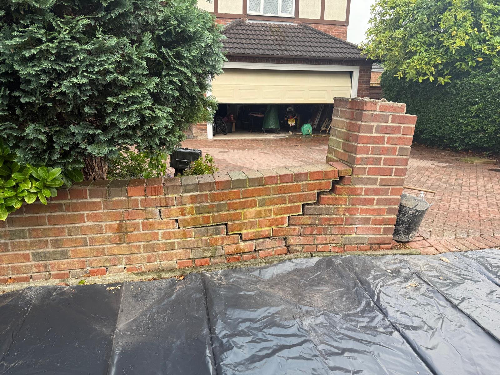 Brickwork repair before root damaged wall